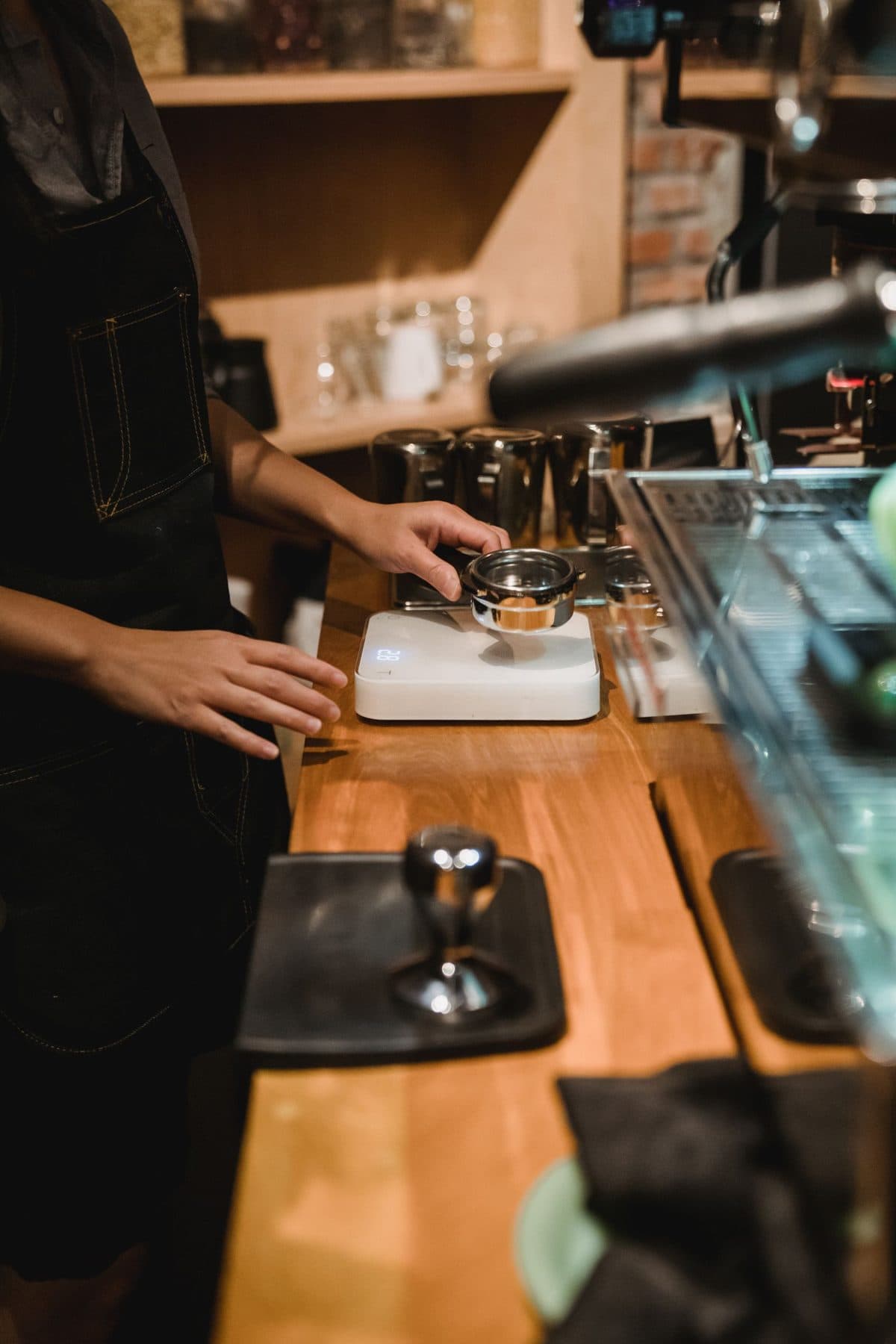A barista prepares espresso